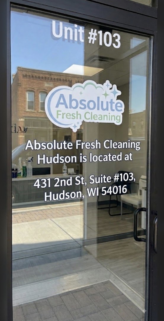 The glass door of Suite 103 at 431 2nd St in Hudson with the Absolute Fresh Cleaning logo and address on it